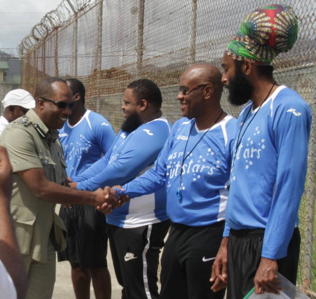 The Futsal programmes is one of acting  Commissioner of
Prisons Gerard Wilson’s favourite success stories. Above,
Wilson greets members of the MSP FUTstars team, comprising of players and coaches at the introduction of the game of Futsal to inmates of the Remand Prison at Golden Grove Prison Facility, Arouca in March.
