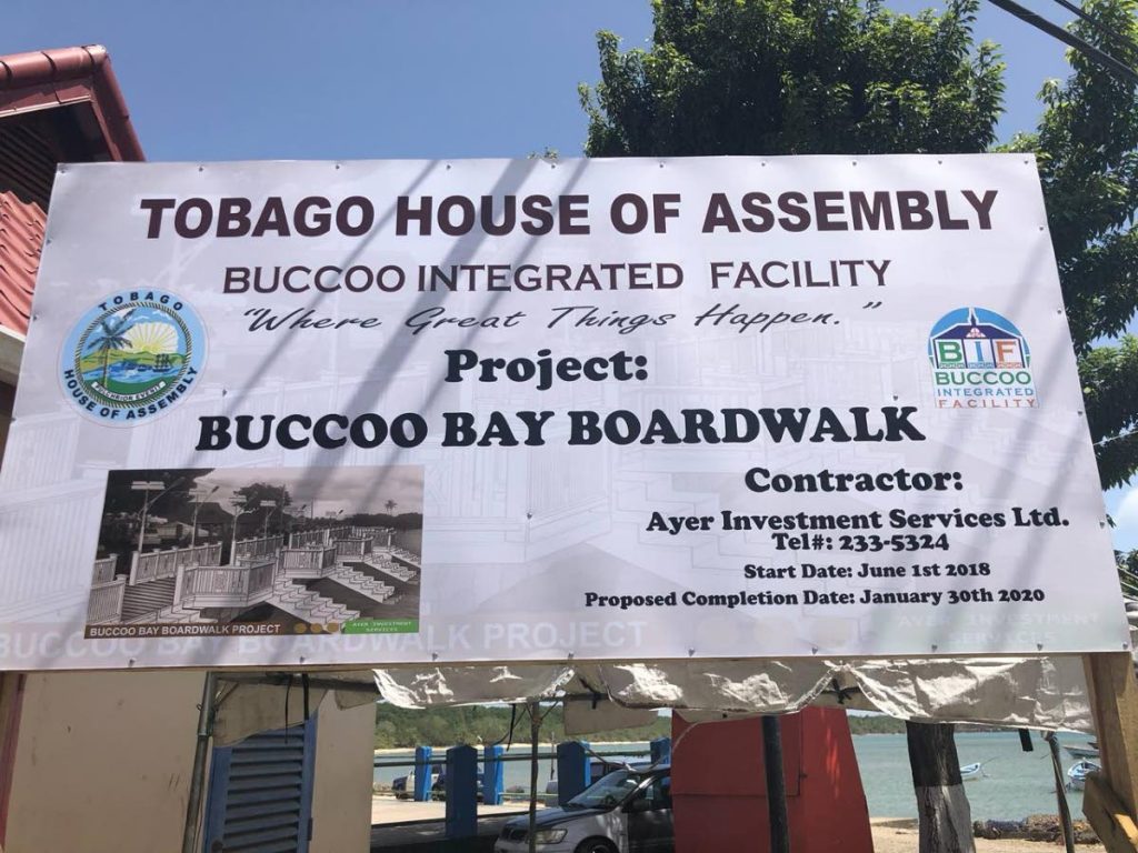 A sign gives details of the Buccoo boardwalk at the project site