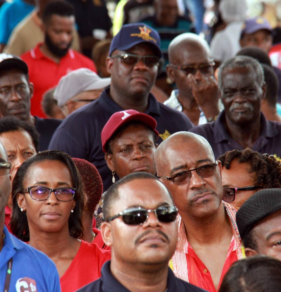 GOVT EYES: At left, MP for La Brea  Nicole Olivierre and at right, Minister of Public Utilities Robert Le Hunte during Labour Day celebrations at Fyzabad, yesterday.