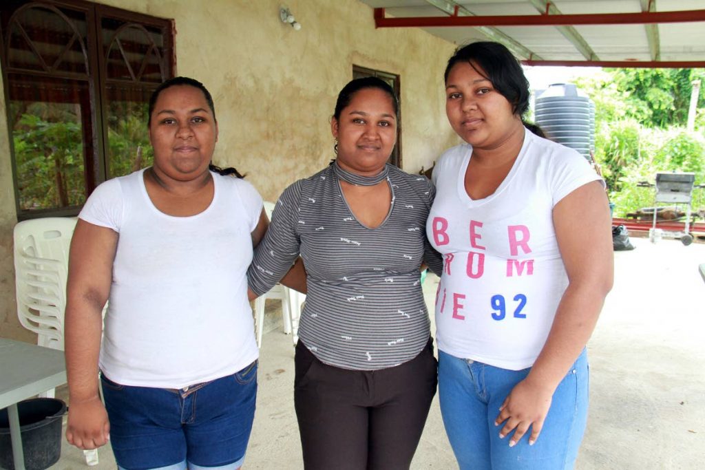 Left to right, Lea, 17, Annesha, 24 and Allisha Sakawath, 20 at their 8 MM Penal Rock Road home after the death of there sister Annise Sakawath. Annise died when she was throwned out of a vehicle during a vehicular accident, which tool place on the Penal Rock Road, Penal.
PHOTO BY ANIL RAMPERSAD.