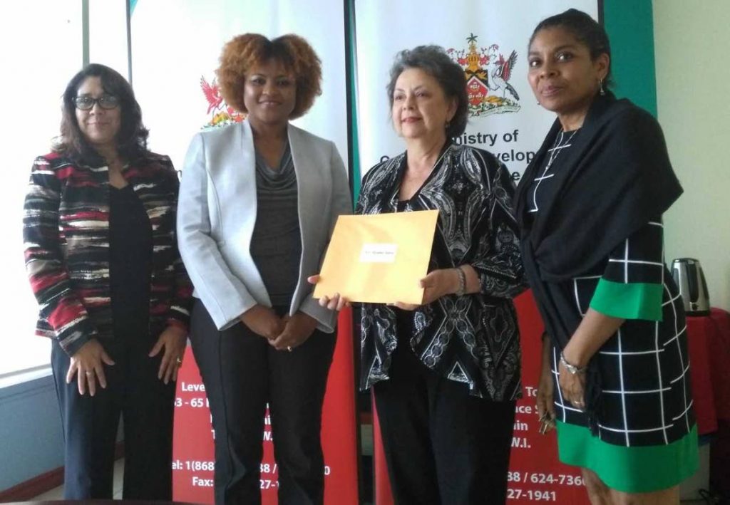 ON BOARD: Mas woman Rosalind Gabriel (third from left) receives her letter of appointment to the NCC board from Culture Minister Dr Nyan Gadsby-Dolly (second from left).  Also in photo are permanent secretary Angela Edwards (left) and deputy permanent secretary Susan Shurland.