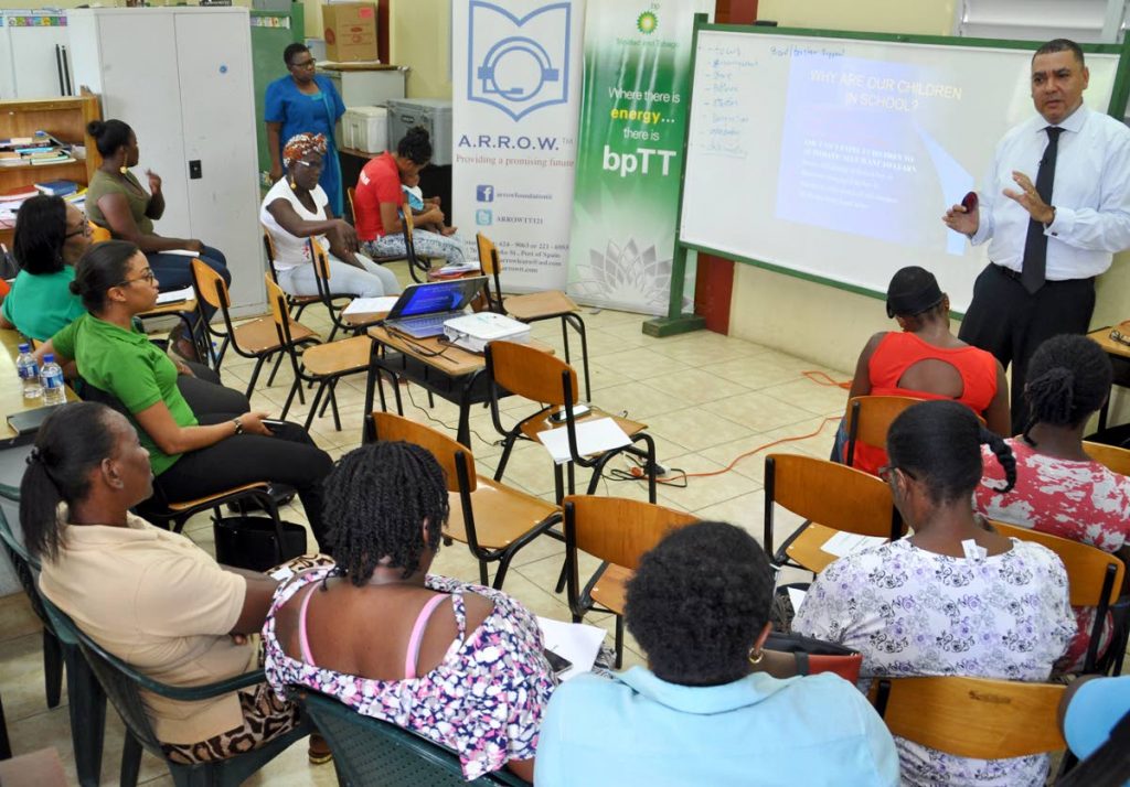 Parents and community members pay keen attention as Christopher Bonterre, director of the local Arrow Foundation, shares some advice on how learning can be enhanced with support from home during a meeting at L’Anse Fourmi Methodist School.