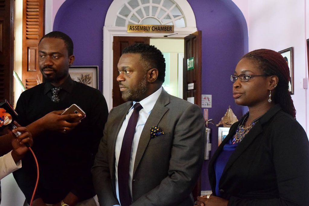 NOT IMPRESSED: Minority leader Watson Duke, centre, and Minority Assemblymen Farley Augustine, left, and Dr Faith B Yisrael give their take on the budget reading on Monday at the THA Legislature Secretariat , Scarborough.