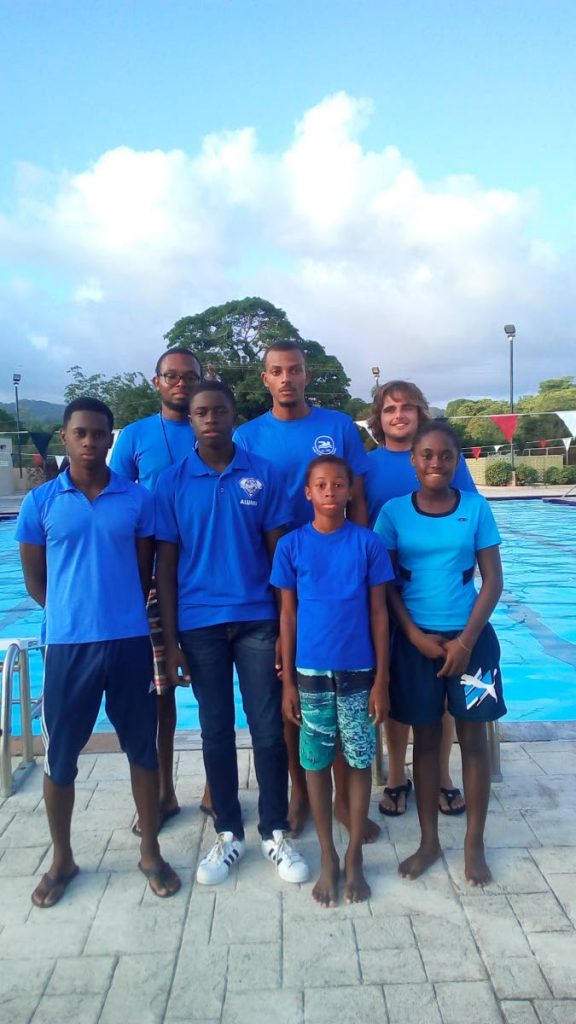 Members of the Tobago Youth Development Centre’s swim team, back row (L-R): coaches Kesron Louis, Bradley Thomas and Harry Davis
Front row (L-R) Ezekiel Wilson, Khamron Martin, Yunique Wilson and Jaylon Campbell pose for a team photo recently.