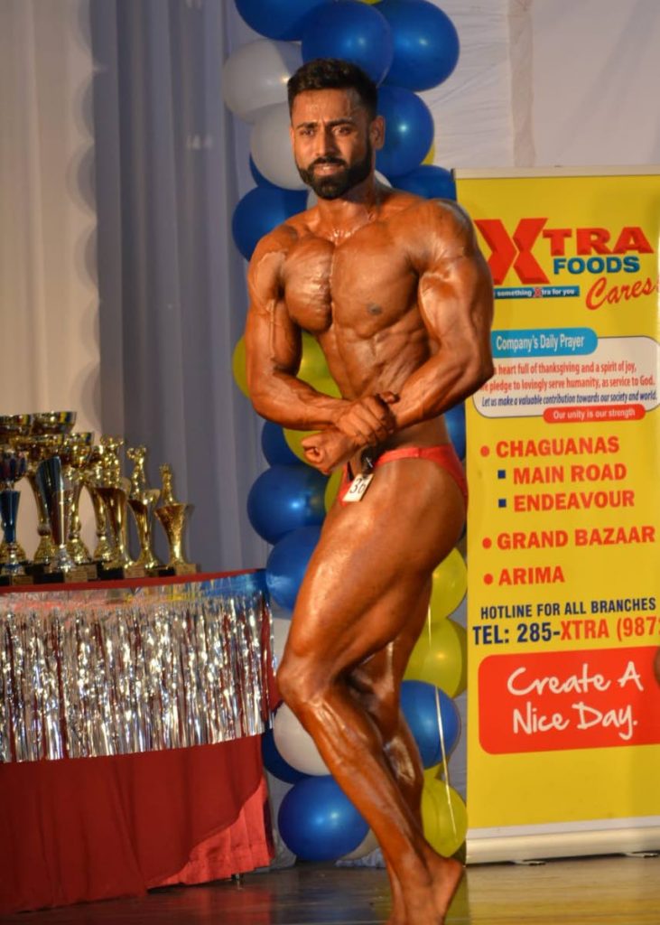 Nicholas Ramoutar flexes his muscles during the recent National Junior Bodybuilding and Fitness Championships which took place at the Cascadia Hotel and Conference Centre, St Ann's.