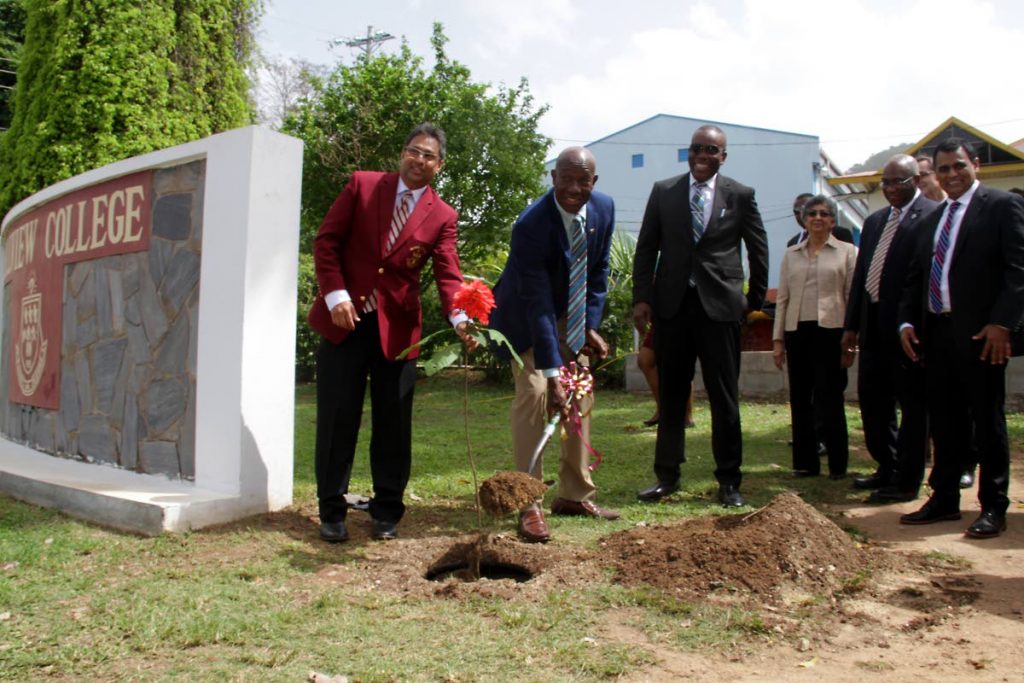 PM Dr. Keith Rowley (2nd from left)  plants a Chanconia seedling, alongside Leslie Mahase, Prinicipal of Hillview College, Esmund Forde, MP for Tunapuna, Yasmin Baksh-Comeau, Curator of National Herbarium of T&T, Prof. Brian Copeland UWI St Augustine Prinicipal and Pro Vice Chancellor and Rohan Sinanan, Works and Transport Minister at the launch of Greening The Urban Landscape - A reforestation project, Hillview College, Tunapuna.  PHOTO BY ROGER JACOB.