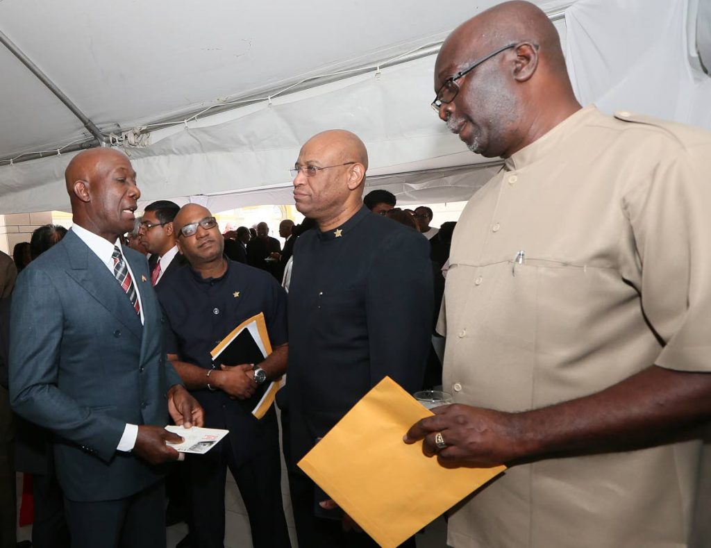 MAIN PHOTO

Flashback: Prime Minister Dr Keith Rowley, left, speaks with OWTU head Ancel Roget, centre, and FITUN general secretary Joseph Remy, right, at the launch of the National Tripartite Advisory Council, Diplomatic Centre, St Ann's on March 15, 2016. OWTU education and research officer Ozzi Warwick, second from left, looks on. FILE PHOTO