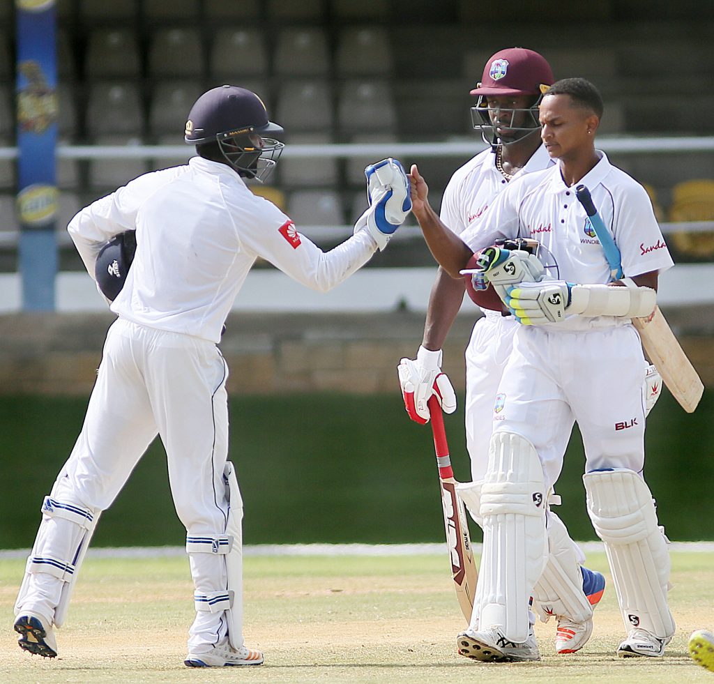 Sri Lankan wicketkeeper Kusal Perera fist bumps WI keeper/batsman Shane Dowrich after he scored a ton at the Queens Park Oval PoS
PHOTO BY AZLAN MOHAMMED
