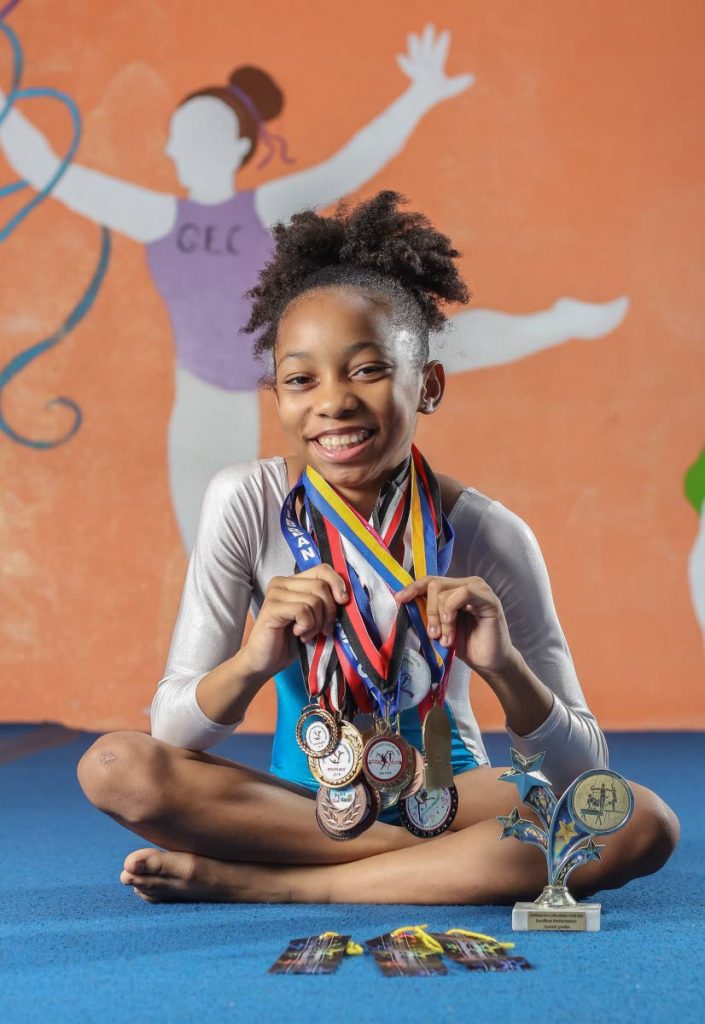 A winner: Azariah Gordon, a member of Gymnastics Explorers Club, has won 15 medals since she began her gymnastics career in pre-school. 
