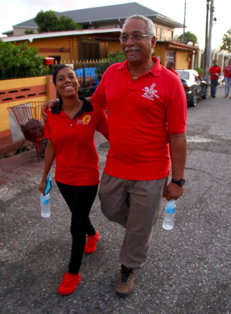 PNM Barataria candidate Kimberly Small with her father, Raymond Small, during a walkabout on June 21. PHOTO BY ROGER JACOB