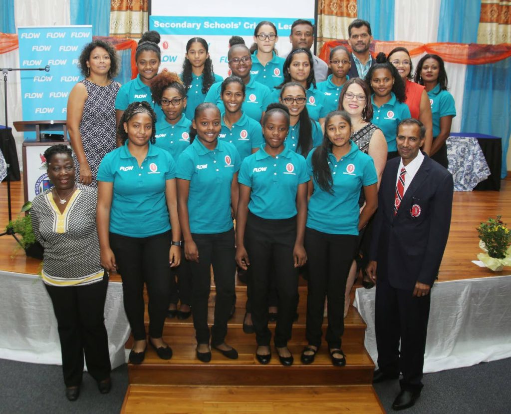 Members of the TT schoolgirls team to tour Canada pose with coach Stephanie Power, front left; Surujdath Mahabir, president of the Secondary Schools Cricket league, and officials of sponsor Flow, at the SSCL awards recently.