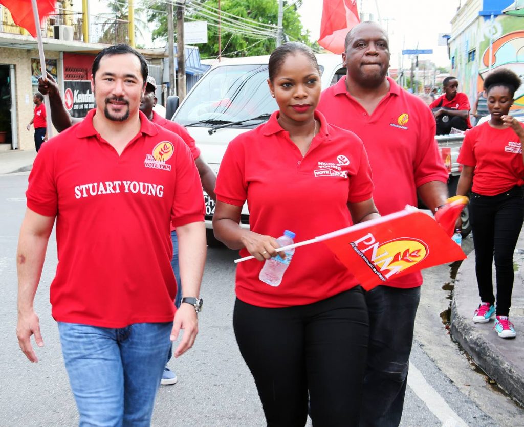 PNM Belmont East candidate Nicole Young accompanied by Minister of Communications Stuart Young, also PoS North/St Ann’s West MP, on a walkabout in Belmont on June 30. PHOTO BY AZLAN MOHAMMED