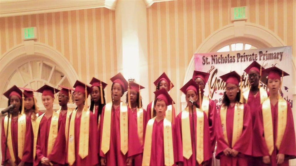 Students of the graduating class of the St Nicholas Primary School in Mt Marie sings at the graduation and awards ceremony for Standard Five students on June 14, held at the Magdalena Grand Beach and Golf Resort in Lowlands.