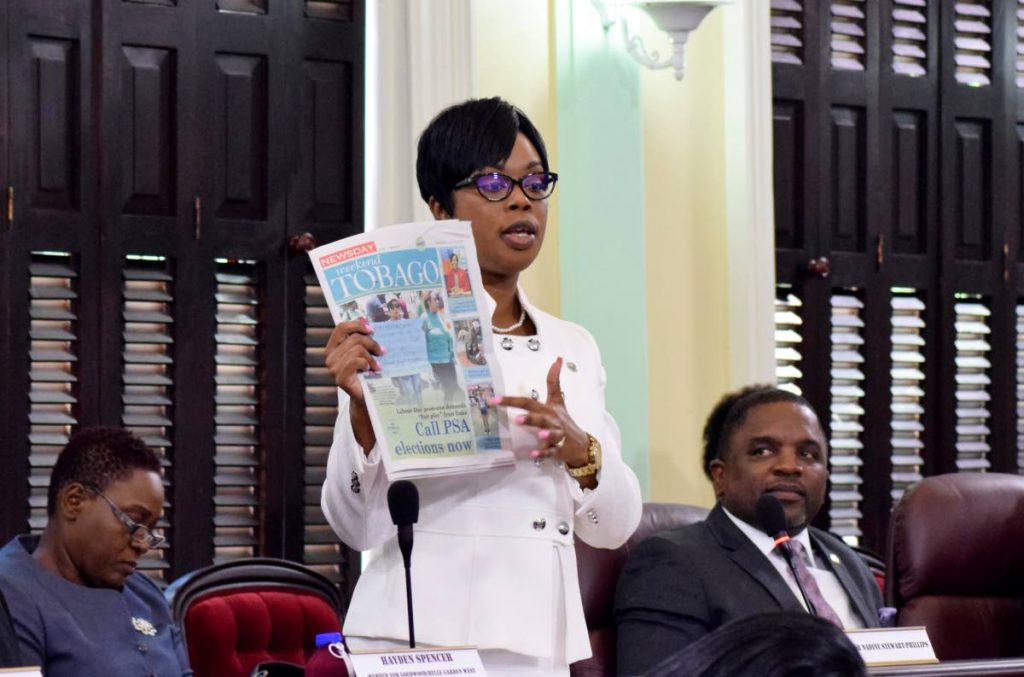 Tourism Secretary Nadine Stewart Phillips refers to a copy of Newsday Tobago during her contribution to the debate on the Tobago House of Assembly 2018/2018 budget proposals in the Assembly Chamber in Scarborough last Thursday. Seated to her right is Finance Secretary Joel Jack.