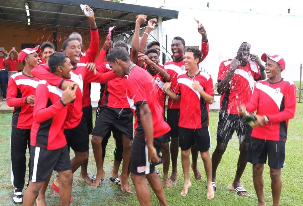 The TT Under-17 cricketers celebrate the 2017 title at the National Cricket Centre in Couva, last year.