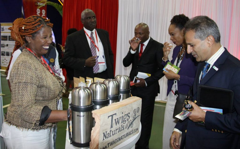 In this 2017 file photo, TSTT Executive VP, Rakesh Goswami (right), chief marketing officer, Camille Campbell and cricket legend Brian Lara, sample tea from Twigs Natural at the Trade and Investment Convention, Centre of Excellence, Macoya.

PHOTO:ANGELO M. MARCELLE
06-07-2017