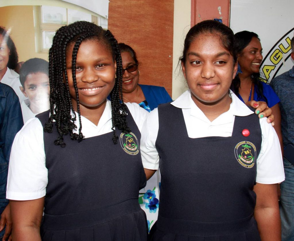 IT PAID OFF: SEA 3rd place students Kavel Pereira and her classmate Rebekah Macoon of the Chaguanas Government Primary School.