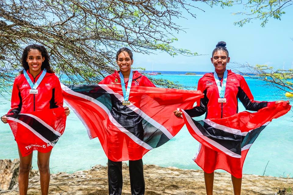 Zoe Anthony, centre, Savannah Chee-Wah,left, and Gabrielle Vickeles,right, won gold, silver and bronze respectively, yesterday in the 3,000 metre U12 female CCCAN Open Water meet, in Aruba.