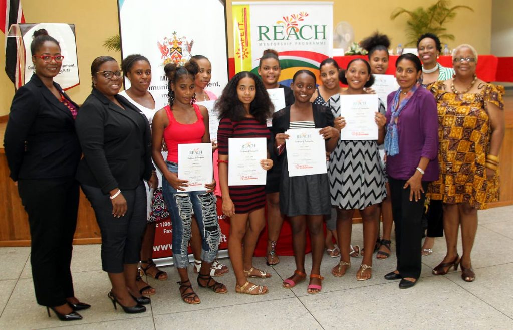 AFETT president Yolande Agard-Simmons, far left, and deputy PS in the Ministry of Community Development, Culture and the Arts Susan Shurland, second from right, with graduates and mentors of the AFETT REACH menorship programme at  Maracas Community Centre, Maracas Bay on Saturday. PHOTO BY ANGELO MARCELLE 