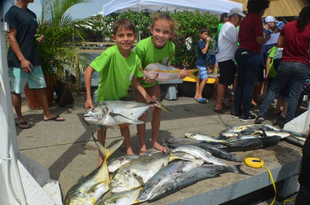 Best Boat winners Jade and Tristan Llanos aboard Team Intrepid show off their catch at the Junior Angler Fishing Tournament on Saturday. 
Photo Courtesy – Ronald Daniel
 
