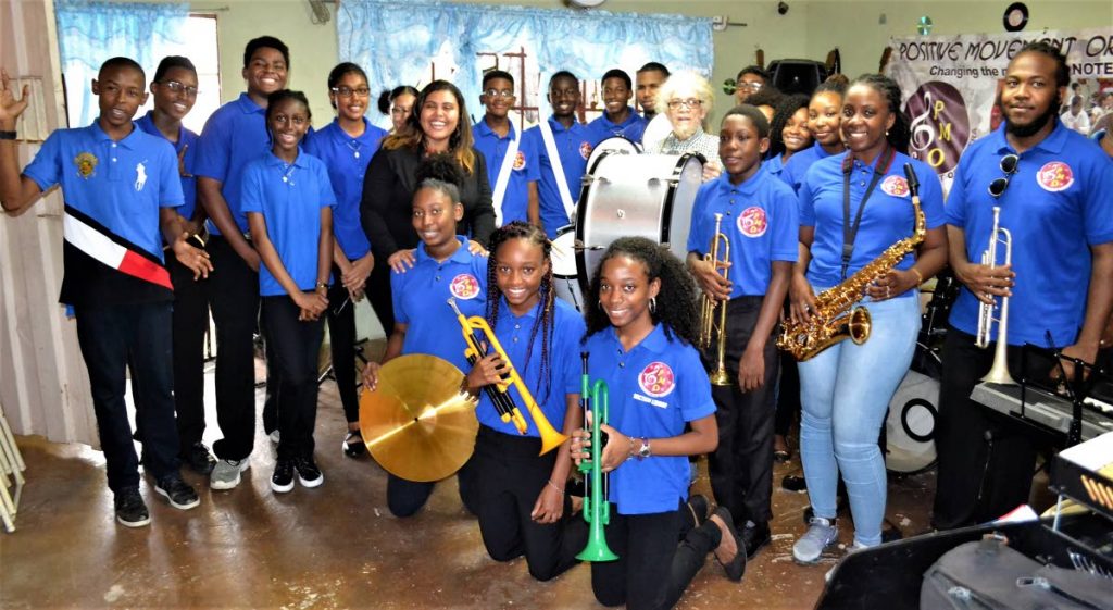 Positive Movement Orchestra's members pose with the newly-acquired instruments.
