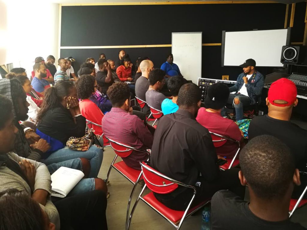 Students listen as Walshy Fire shares his experiences in the music industry after his Rum & Bass event.