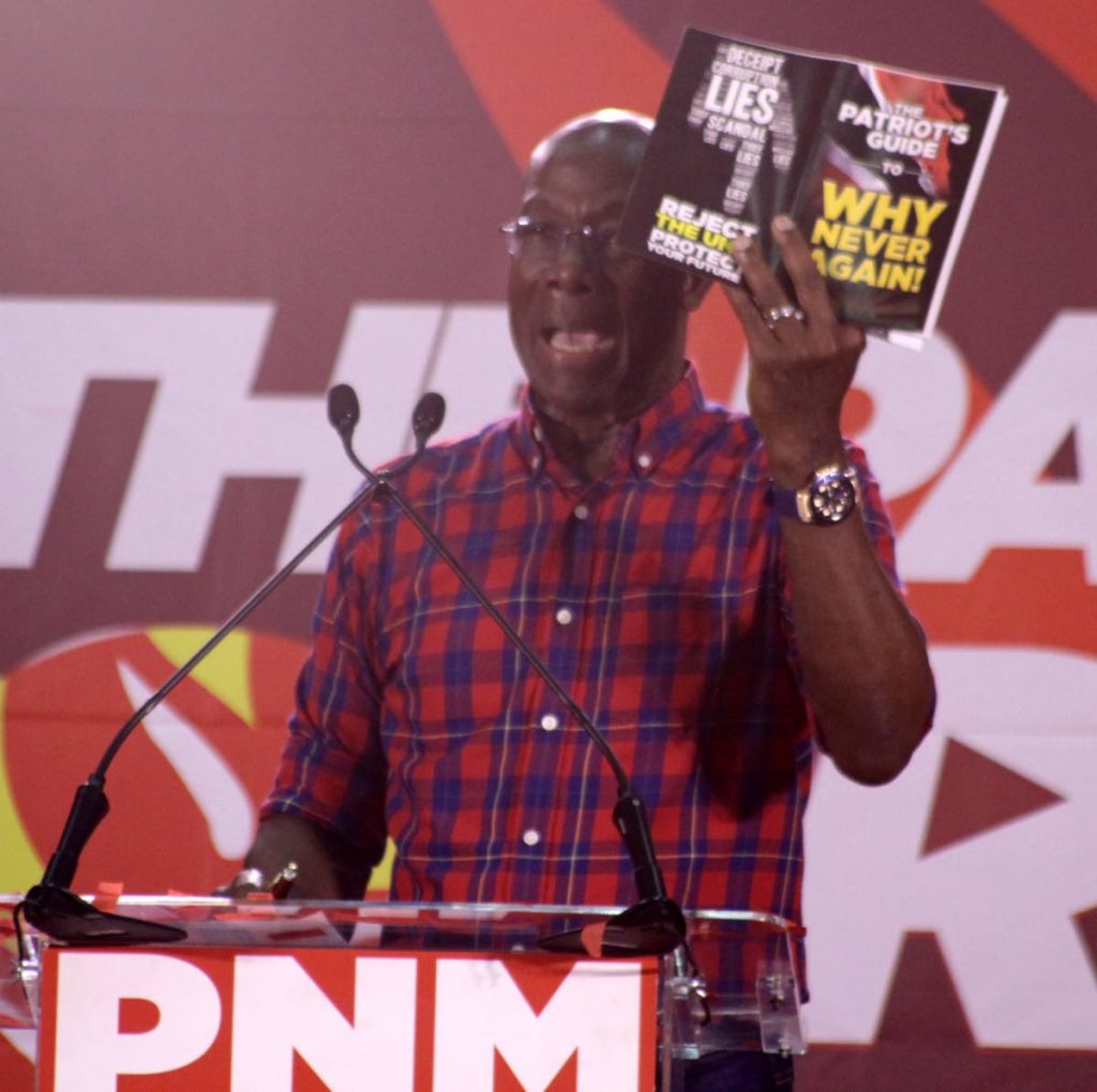  PM Dr. Keith Rowley, Political Leader of PNM, with PNM publication, 