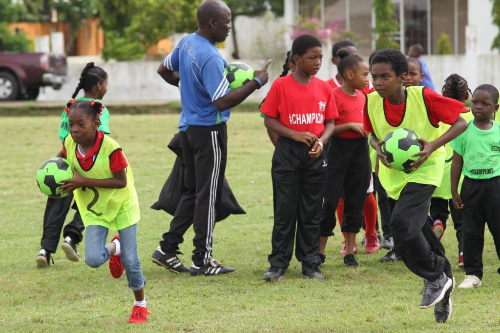 Children taking part in shuttle running on the final day of an outreach sporting  programme put on by the Chaguanas Borough Corporation and the US Embassy civil affairs unit. The caravan was held at the Esmeralda sporting grounds Chaguanas 

Holder                           14-7-18