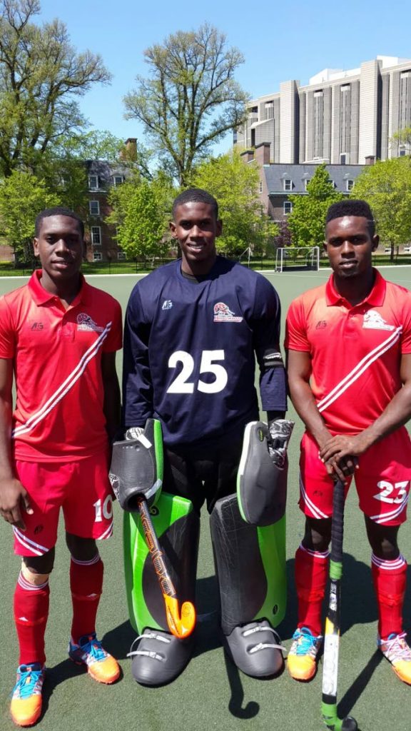 Former national under 21 goalkeeper Kwasi Emmanuel, centre, poses with his brothers Kristien and Keiron at the 2016 Pan Am Hockey Tournament in Canada.