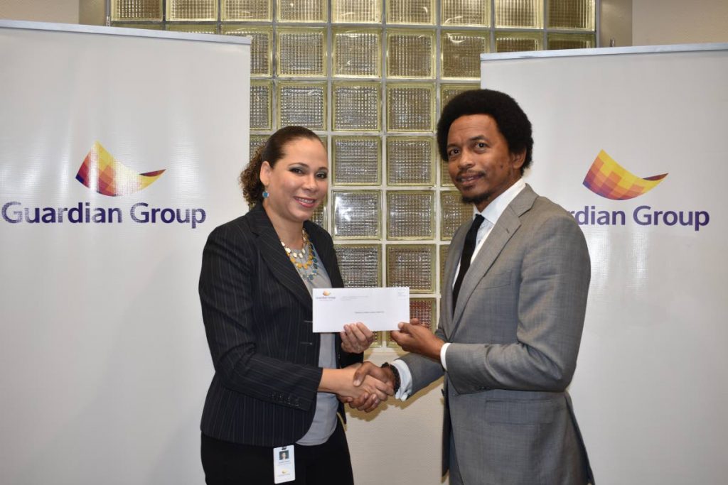 TTOC president Brian Lewis , right, collects a cheque from Ayesha Boucaud-Claxton, Guardian Group’s senior manager, group corporate communications, to aid the TTOC's #10golds24 athlete welfare and preparation fund recently. 