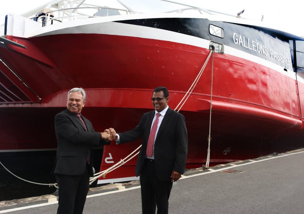 July 17, 2018. Minister of Finance, Colm Imbert shakes hands with Minister of Works and Transport Rohan Sinanan, in front of the Galleons Passage vessel at the Port of Port of Spain. Photo by Xavier Sylvester