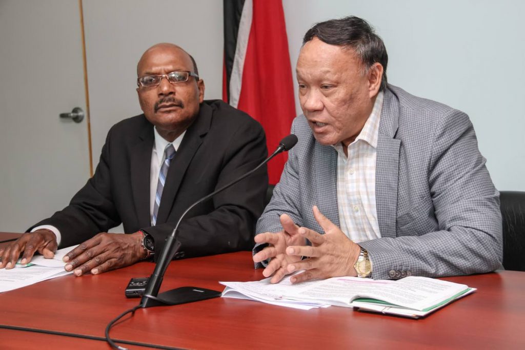 KEEPING IT SHORT: UNC member for Point a Pierre David Lee answering questions during a press conference at the Office of the Leader of the 
Opposition, Port of Spain, yesterday. Also in photo is UNC Senator Wade Mark.