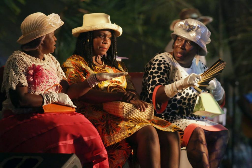 Actresses perform in a scene from Black Rock’s 2018 Tobago Heritage production, Honouring the Past, Celebrating the Future, last Thursday night at the at the Courland Heritage Park.