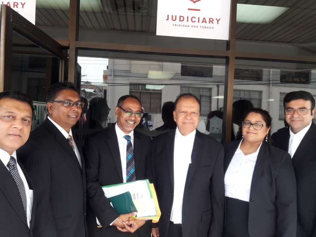 Khemraj Harrikissoon SC (centre) with his fellow attorneys outside San Fernando High Court after he was invited to the inner bar. At right is Harikissoon's daughter Ambika and son Narad, both attorneys