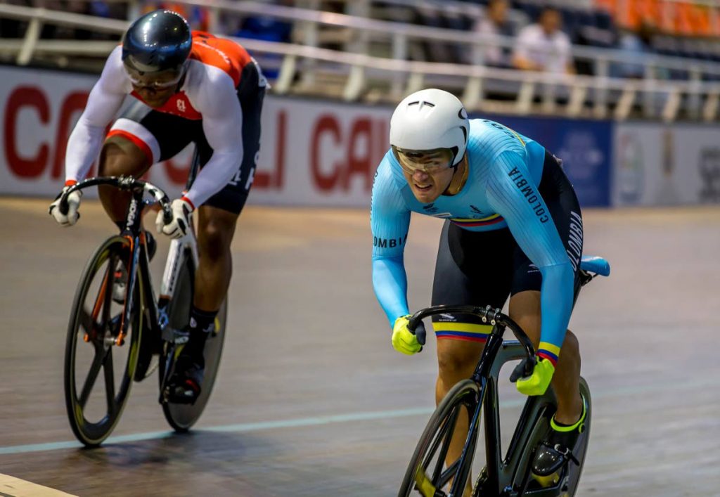 TT’s Nicholas Paul (left) defeated Colombia’s Fabian Puerta (right) to win the men’s time trial final at the CAC Games in Barranquilla, Colombia yesterday.