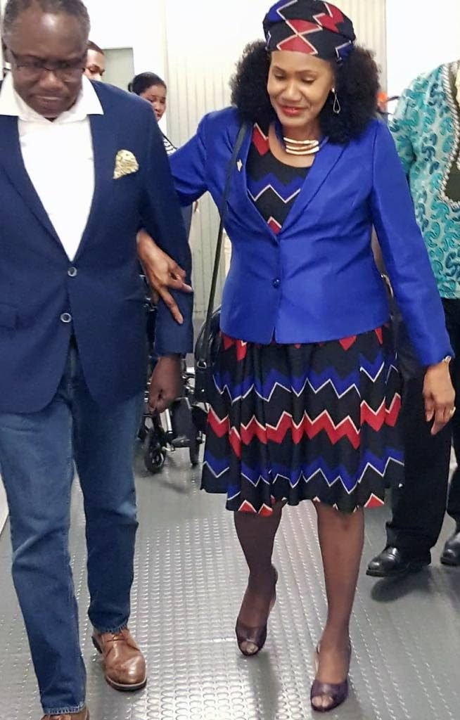 BACK HOME: La Horquetta/Talparo MP Maxie Cuffie with Labour Minister Jennifer Baptiste-Primus Thursday night shortly after he returned home at Piarco International Airport on a flight from the US where he was recuperating from a stroke he suffered in September. 
