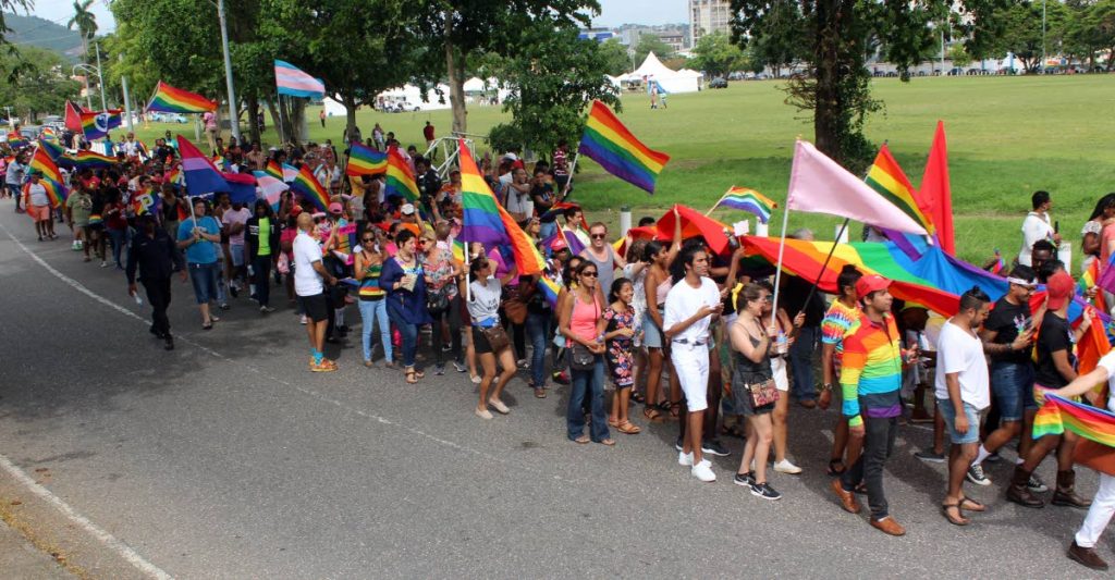 Members of the LGBTQI community and well wishers take part in TT's first gay pride parade throught the streets of Port of Spain yesterday. PHOTO BY ENRIQUE ASSOON