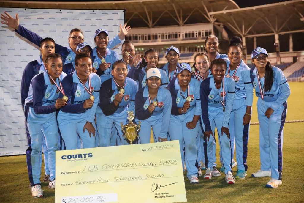 Champions LCB Contractors Central Sharks show off their medals, cheque and trophy after winning the Courts T20 Grand Slam Tournament on Saturday at Brian Lara Academy, Tarouba. PHOTO BY Allan V. Crane/CA-images