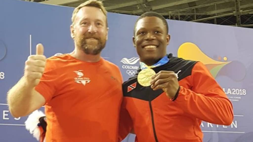 National cycling technical director Erin Hartwell, left, poses with CAC triple gold medallist Nicholas Paul in Colombia recently. 