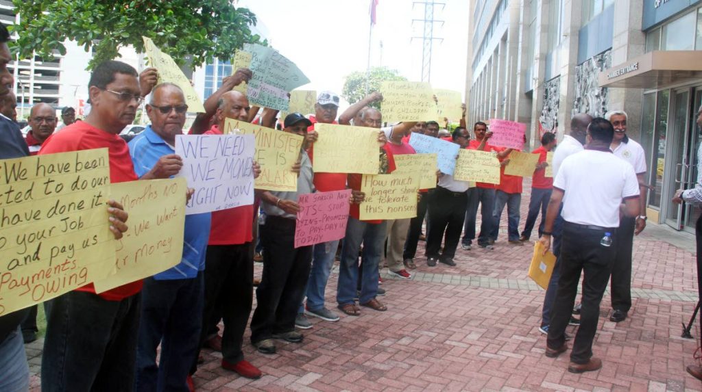 File photo: Maxi taxi school transport operators outside the Parliament yesterday calling for the Ministry of Education to pay them money owed for the past six months. PHOTO BY SUREASH CHOLAI
