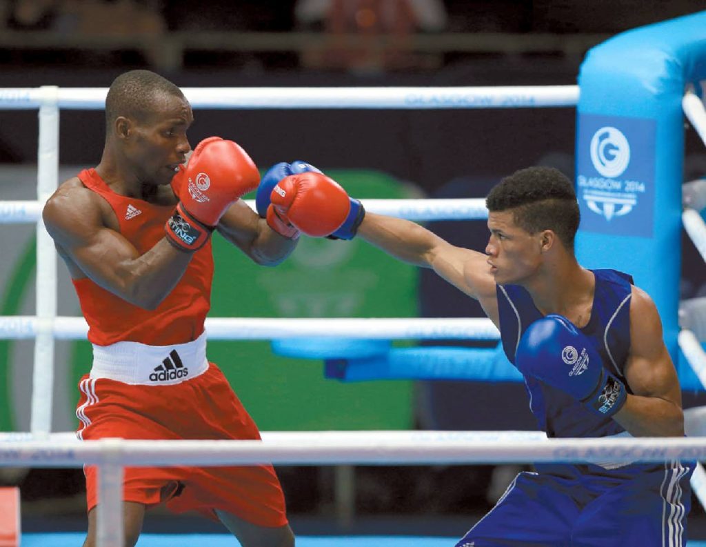 FLASHBACK: TT's Michael Alexander, right, will fight for gold at the CAC Games on Thursday. 