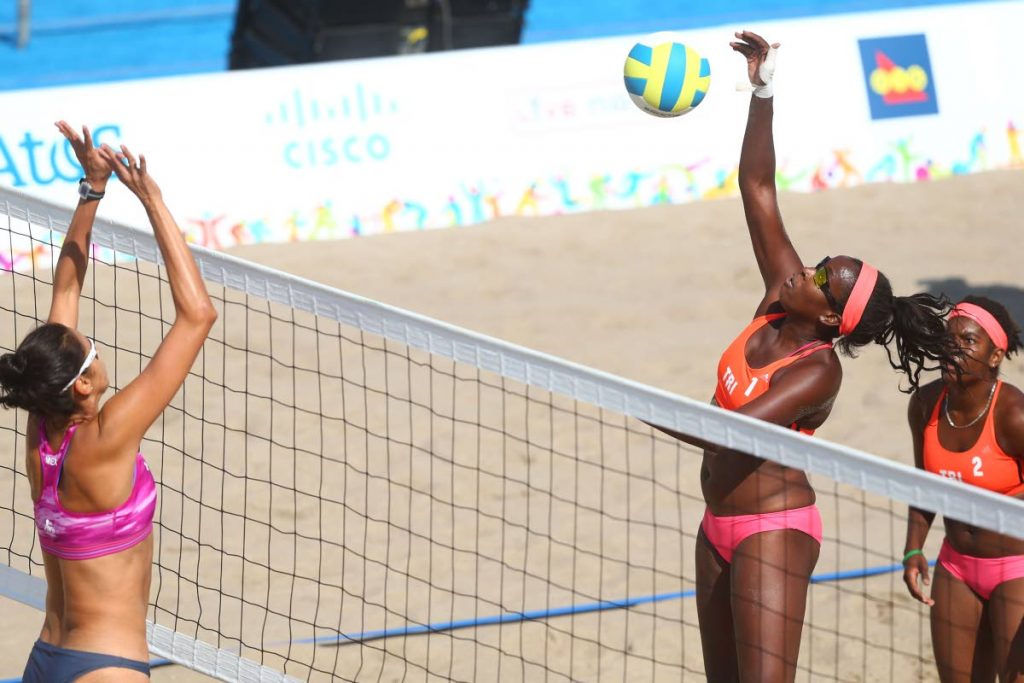 TT’s Ayanna Dyette, second from right, competes at the 2015 Pan Am Games alongside partner Malika Davidson, right, against Mexico in Toronto, Canada.
