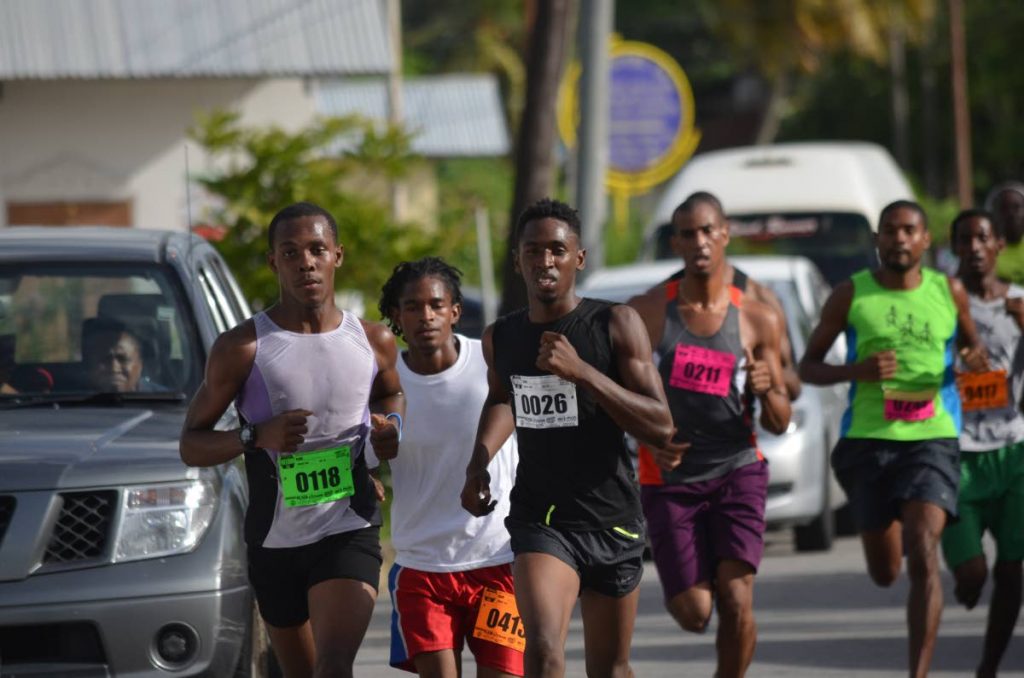 Athletes take off at the start of the 2016 Emancipation Freedom Run in Walke Street, Sangre Grande.