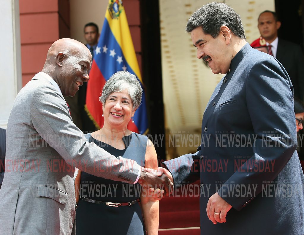 File photo: Venezuela’s President Nicolas Maduro happily welcomes Prime Minister Dr Keith Rowley to the Miraflores presidential palace in Caracas where the two leaders sealed a deal for TT to process natural gas in the Dragon field. PHOTO BY AZLAN MOHAMMED