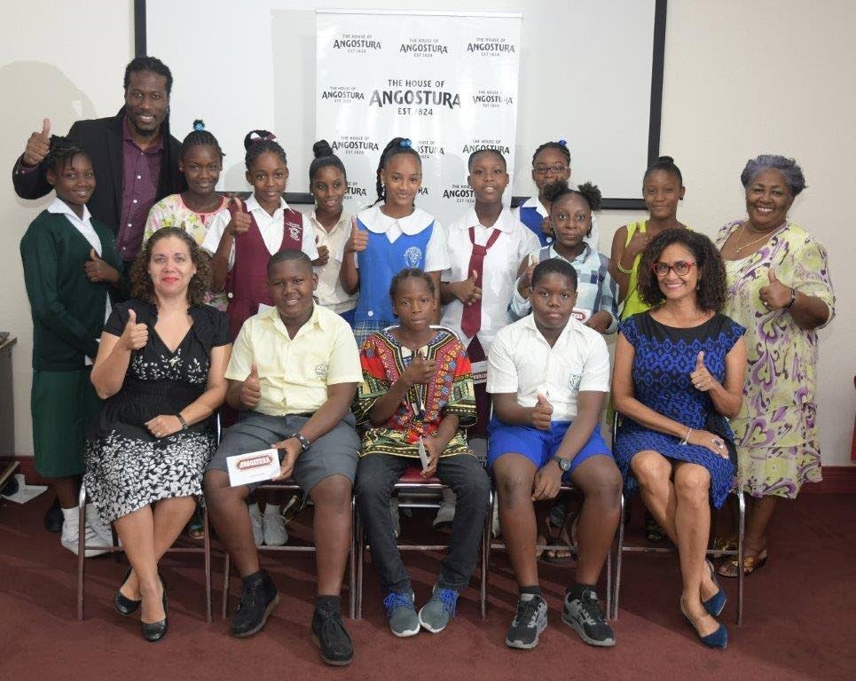 Recipients of the Angostura SEA Top Achiever Awards with Thora Best, back right, Giselle Laronde-West, front right, and Ronda Betancourt from Angostura, front left.