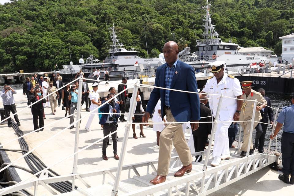 Prime Minister Dr Keith Rowley boards a Coast Guard vessel docked in Staubles Bay, Chaguaramas during a visit to Coast Gaurd headquarters.