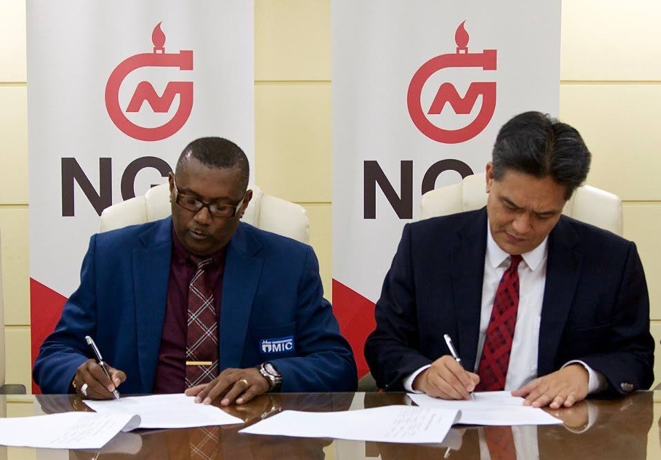 NGC signs MOA with MIC-IT to sustain the future of pan: Signing of the Memorandum of Agreement between NGC’s President Mark Loquan and MIC-IT’s CEO Brian James on July 26, 2018 for the delivery of a customized “Mechanical Engineering Technology with Steelpan Manufacturing” Programme to members of NGC’s sponsored and part-sponsored steelbands. PHOTO COURTESY NGC.