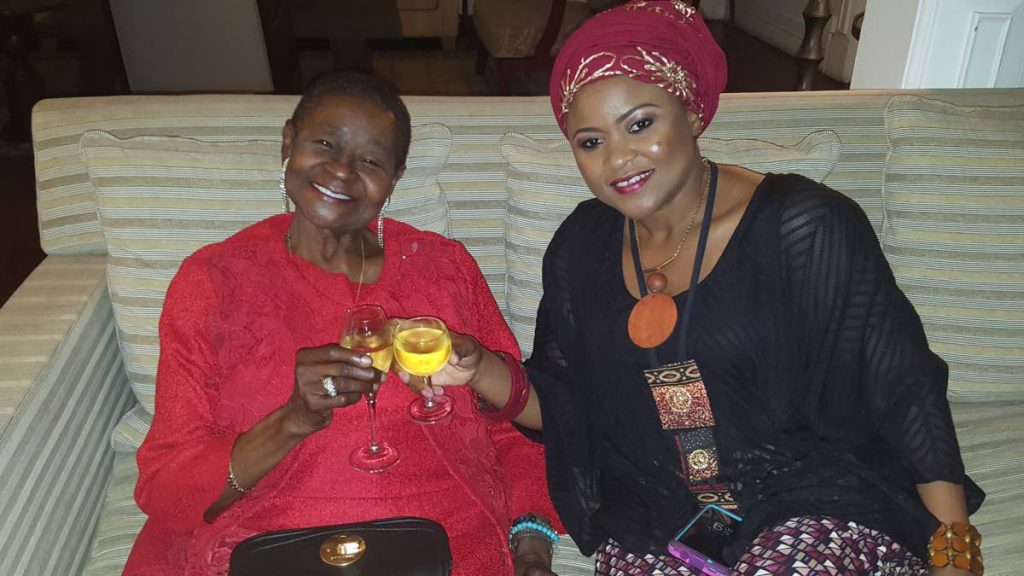 Calyps Rose shares a toast with Community Development, Culture and the Arts Dr. Nyan Gadshy-Dolly, at a reception at the French ambassador’s house.