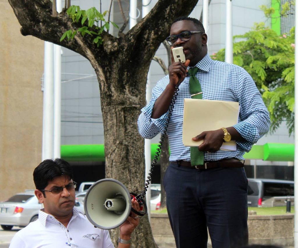 MY MESSAGE: PSA president Watson Duke speaks to protesting public servants yesterday outside the Eric Williams Financial Complex in Port of Spain. PHOTO BY ENRIQUE ASSOON