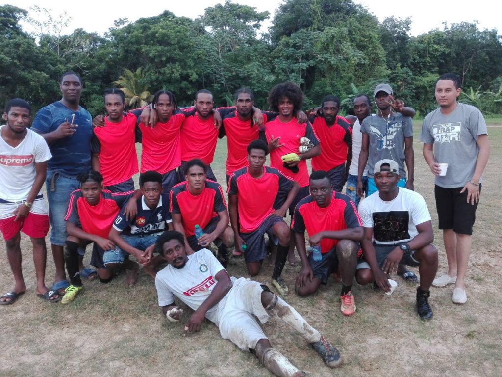 Sangre Chiquito FC and their supporters pose for a team photo after winning the first match of the Caribbean Welders Fishing Pond League on Saturday.  